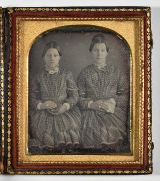 [Two Young Women Holding Books]