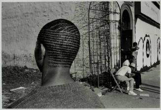 Channel Haircut in Front of the El Rukn Temple (now demolished), Chicago, Illinois