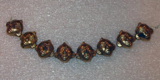 Eight Beads in the Form of Human Heads, Strung Together