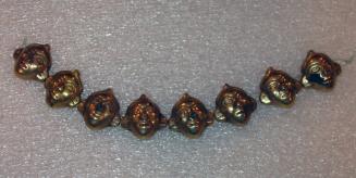 Eight Beads in the Form of Human Heads, Strung Together