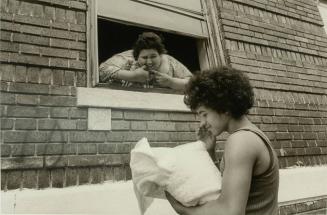 Victor Showing Gladys His New Baby on Her First Day Home from the Hospital, July 1978