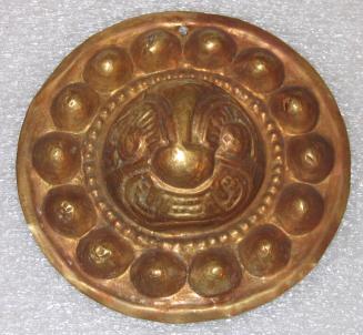 Disk Pectoral Ornament with a Feline Face