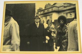 Untitled (man on corner, woman with afro, DC)