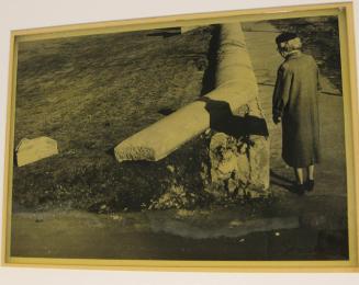 Untitled (old woman at broken stone ledge, Rochester, NY)