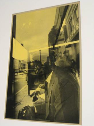 Untitled (man with hat in bus shelter, "peoples", DC