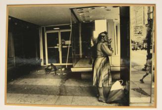 Untitled (woman putting lipstick on in store front mirror, DC)