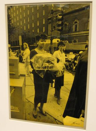Untitled (woman carrying cake in the shape of a woman, DC)