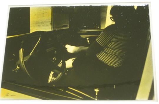 Untitled (woman in car with bandaged foot, DC)