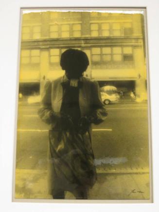 Untitled (woman in bus shelter with ticket in mouth, DC)
