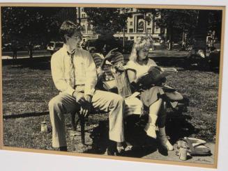 Untitled (girl pointing on bench between two others, DC)