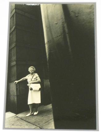 Untitled (woman with white purse and shoes leaving building, M.D.)