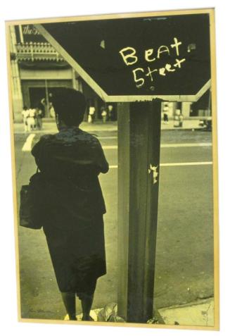 Untitled ("Beat Steet" graffiti on sign with woman, D.C.)