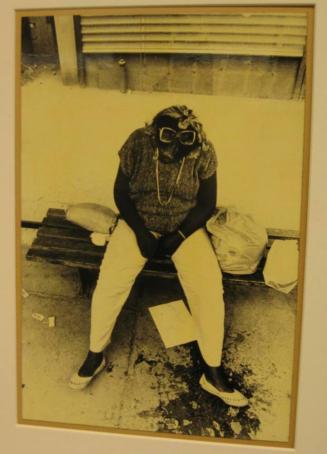 Untitled (woman in bus shelter with glasses on head, DC)