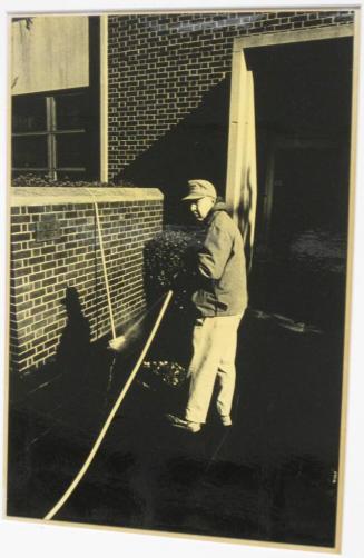 Untitled (man with hose spraying broom, DC)