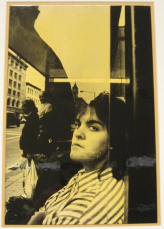 Untitled (girl with striped shirt looking from bus shelter, DC)