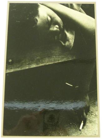 Untitled (woman on bench, sleeping, holding cigarette, DC)