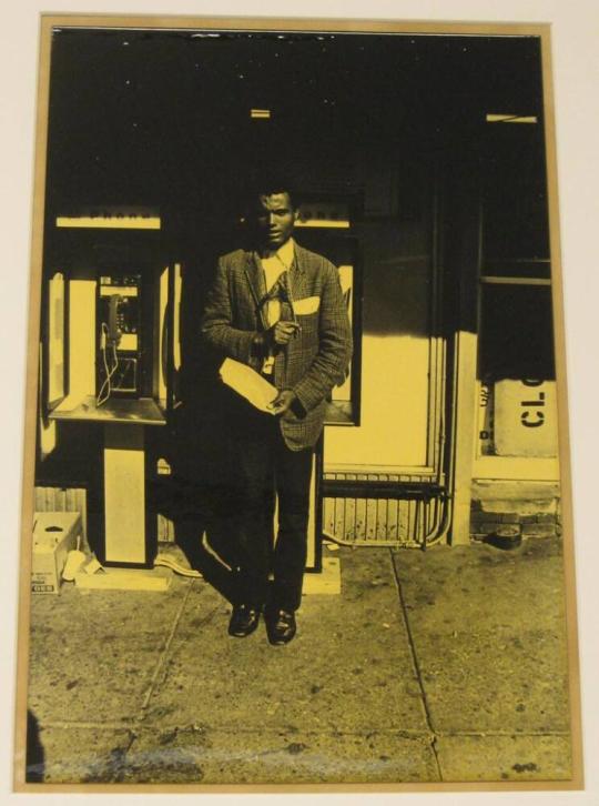 Untitled (man holding American flag)