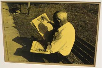 Untitled (man with shadow on newspaper)