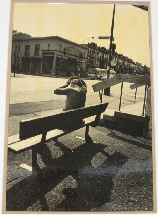 Untitled (man on bench combing hair, Montreal)