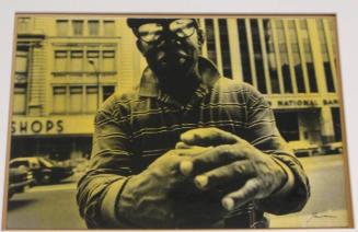Untitled (man with striped shirt, reflection in glasses, and hands folded)