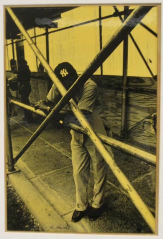 Untitled (man with Yankee cap leaning against pipes, DC)