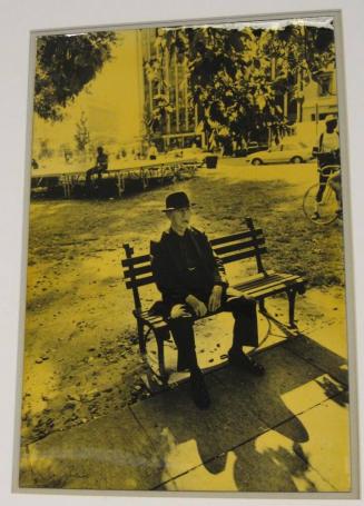 Untitled (man on bench with cigar, DC)