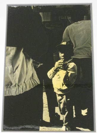 Untitled (boy with Yankee hat and fingers in mouth, DC)
