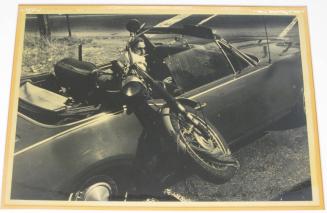 Untitled (man with motorcycle in back seat, DC)