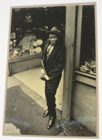 Untitled (hunchback man with fedora and black shoes, DC)