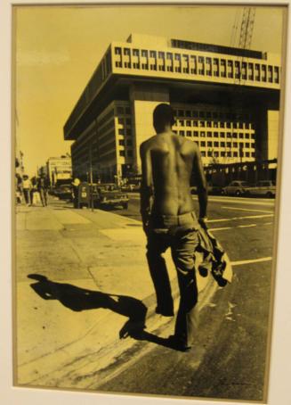 Untitled (young man crossing street, falling pants, DC)