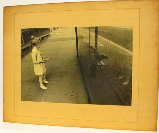 Untitled (child viewing passed-out man in bus shelter, DC)