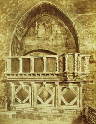 The lower church of S. Francesco-the pulpit and a fresco.