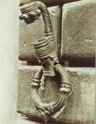 A  wrought iron flag holder at a palazzo in Cortona.