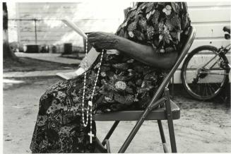 A Woman Prays the Rosary...