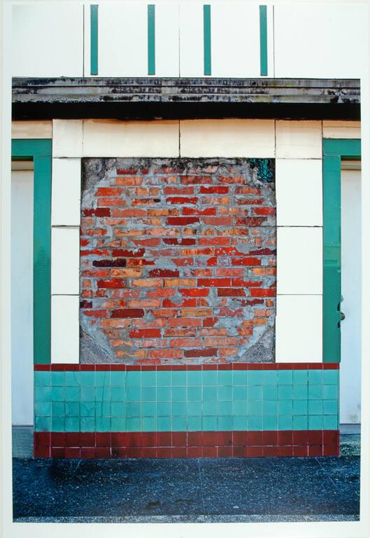 Brick Wall Surrounded by Green and White Tile