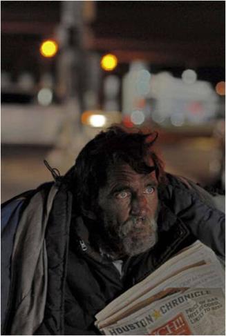 Barry lives at Monroe and I-45 since a death in [his] family.  He earns his living selling newspapers