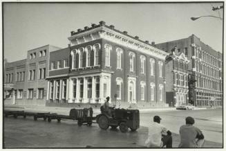 Right to left, The Stewart Title Building, next the Trueheart-Adriance Building, and center, The First National Bank Building, circa 1878, design attributed to J.M. Brown, who is also said to have supervised its construction