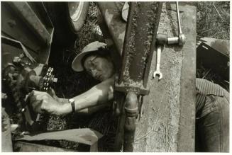 Edna Harris Repairing Hay Bailer, Harmony, Iredell County, North Carolina