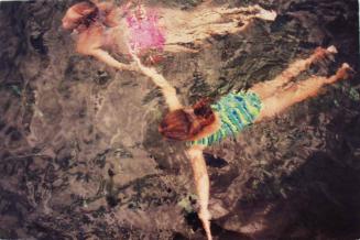 Two girls underwater