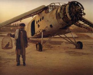 Old biplane on a display plinth at the Exhibition Grounds in Kabul. Fighting birds are a source of great pride to Afghan men, but were banned by the Taliban as un-Islamic