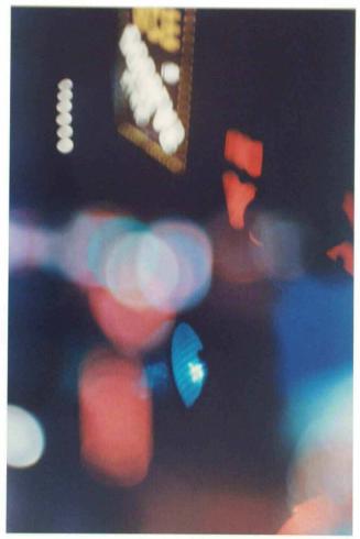 New York, N.Y. [abstraction of advertising and traffic lights]