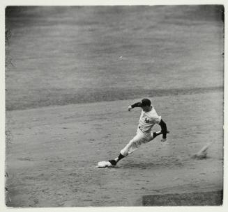 Yogi Berra arguing with umpire over his safe call in the 1st