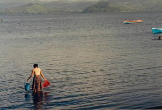 Woman Wading with Two Buckets