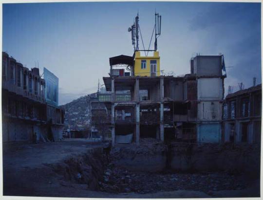 A cellphone booster-station built on the wreckage of buildings that once housed a market.