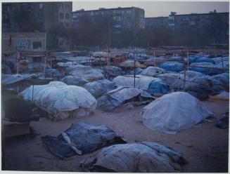 An informal market in the ‘Mikrorayon 4’ housing area, covered up for the night.