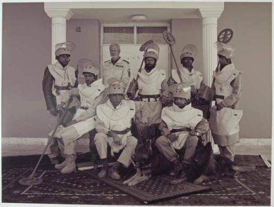 A de-mining team from the Mine Detection Centre in Kabul with a member of the German Police who is mentoring them.