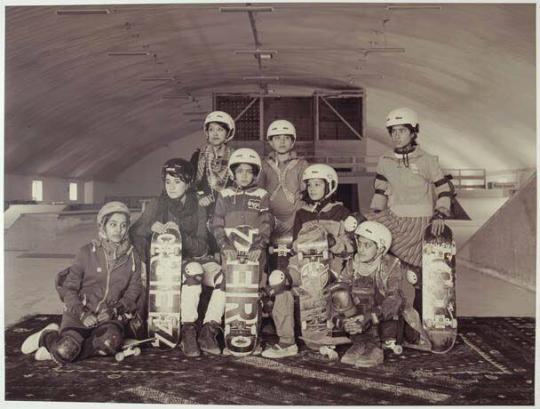 Young women in the indoor skatepark of the NGO 'Skateistan', set