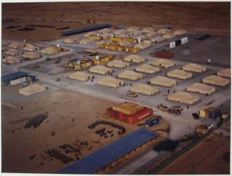 A storage yard at Kandahar Airfield looking out beyond the wire, back into ‘Afghanistan’.