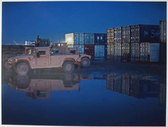 There are 16,000 US Marines aboard Camp Leatherneck spread over 1,600 acres. Empty shipping containers are used as storage, wind breaks or blast walls. In May 2010 a mysterious fire, that may have been sabotage, destroyed 9 acres of containers. It burned so furiously that fire fighters even lost two of their fire engines.