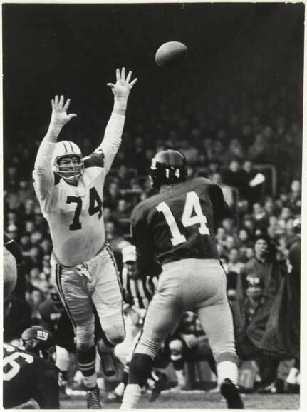 The Dallas Cowboys, in light jerseys, playing against the New York